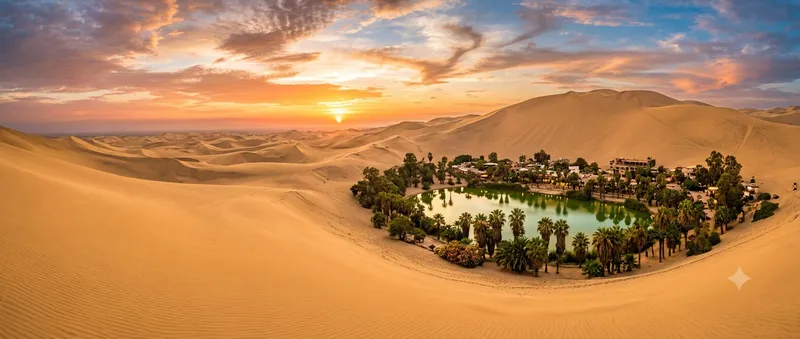 Huacachina oasis surrounded by golden sand dunes at sunset