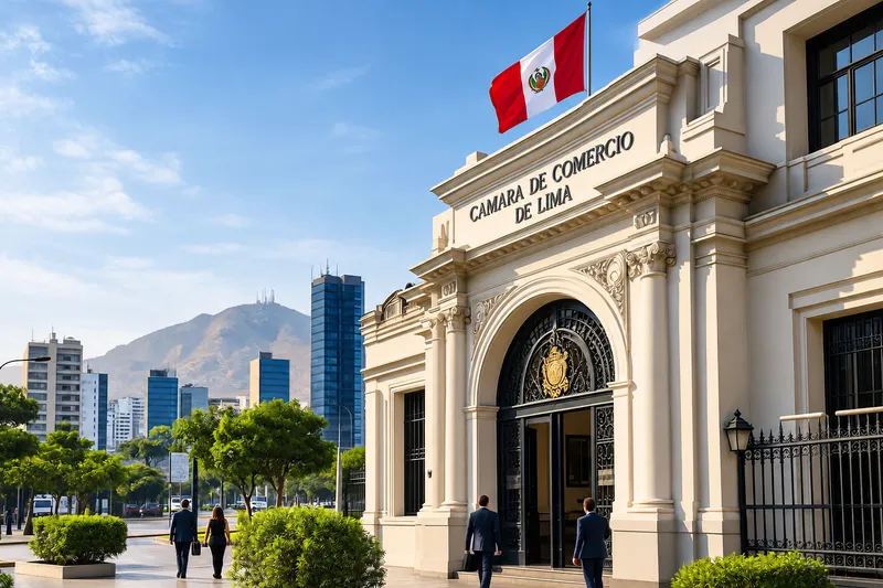 Neoclassical chamber of commerce building in Lima with a Peruvian flag, business professionals outside and city towers in the background
