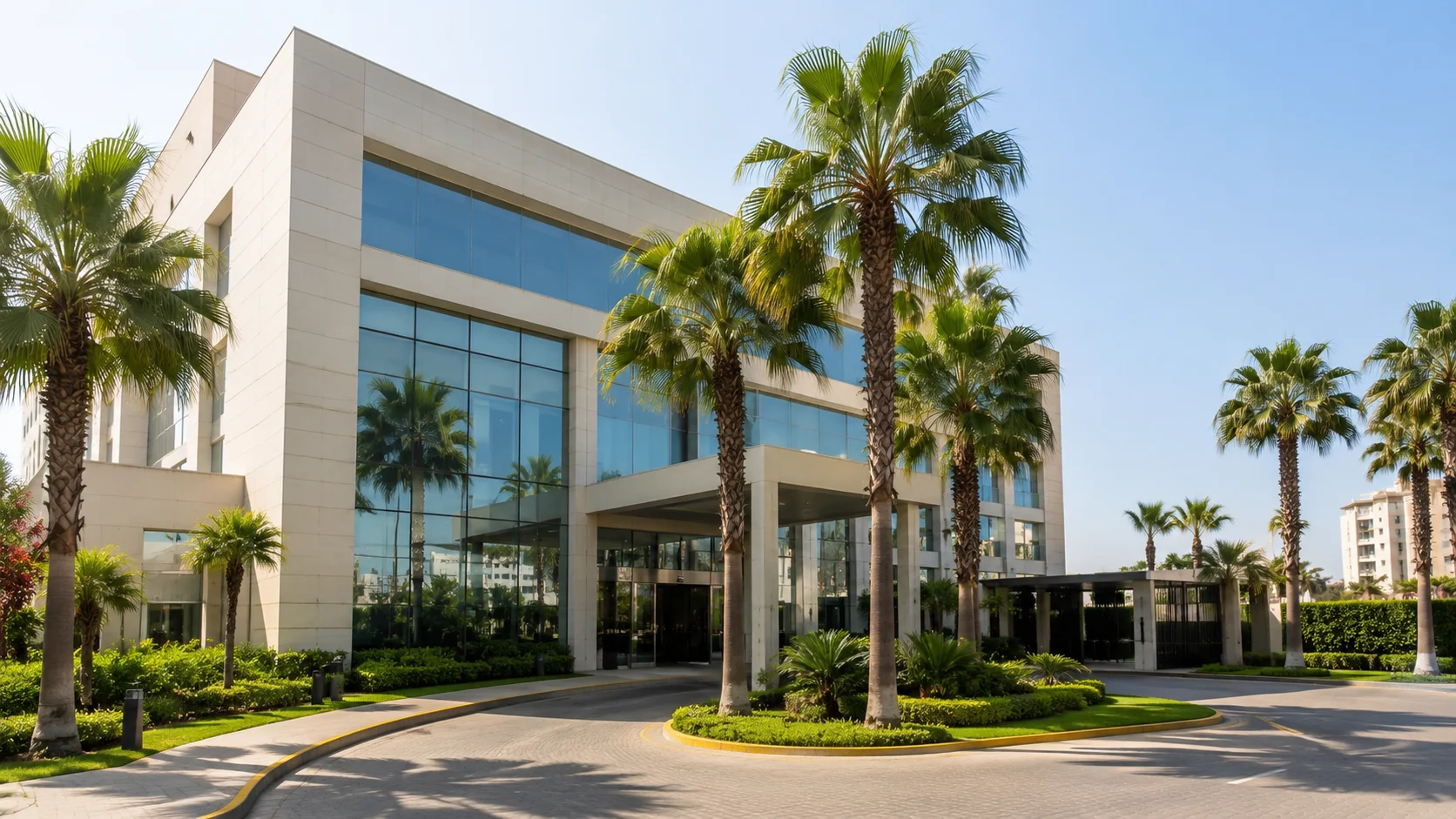 Modern luxury hotel exterior in Lima surrounded by palm trees