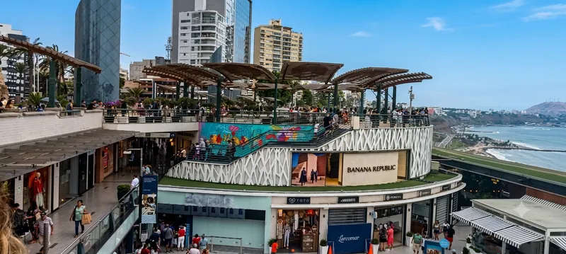 Rooftop terraces and modern towers above Larcomar shopping center on the Miraflores clifftop, Lima